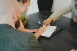 Landlord and tenant signing a lease agreement