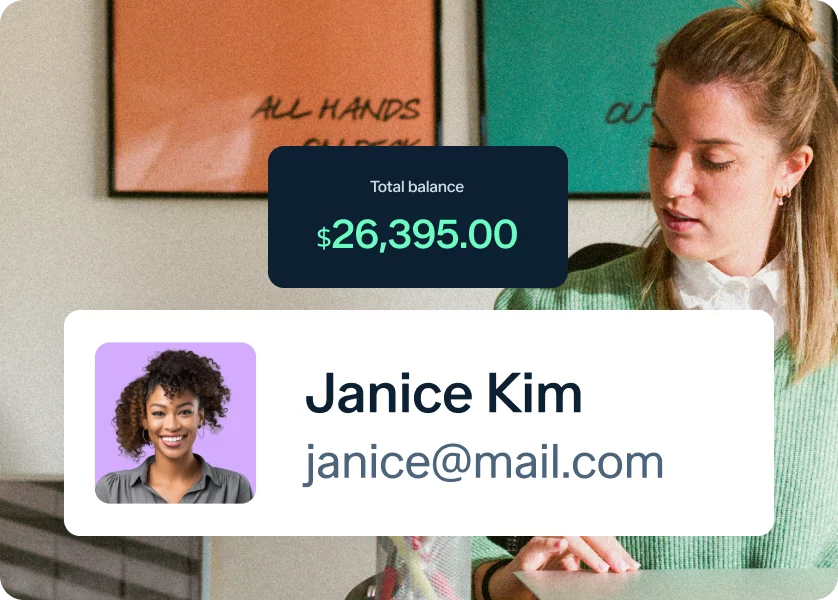 A woman is sitting at a desk, writing on paper. Above her is a display showing a total balance of $26,395.00. Below her image, there's a profile card with the name "Janice Kim" and an email address "janice@mail.com.