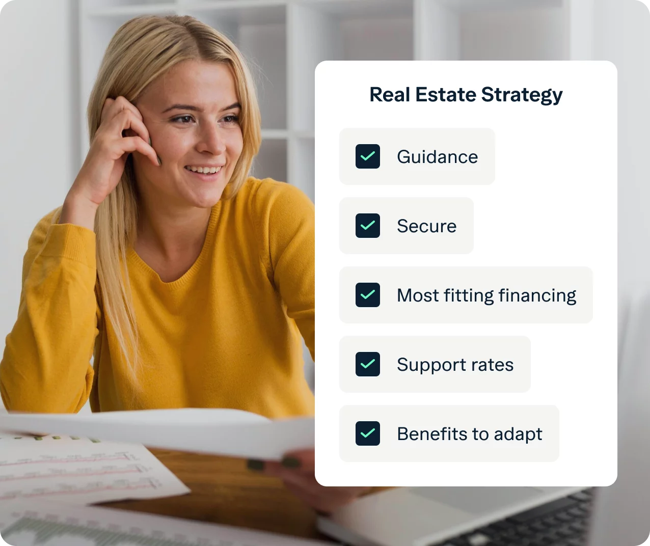 A smiling person with long hair, wearing a yellow sweater, sits at a desk with papers and a laptop. Next to them is a checklist titled "Real Estate Strategy" with items: Guidance, Secure, Most fitting financing, Support rates, and Benefits to adapt.