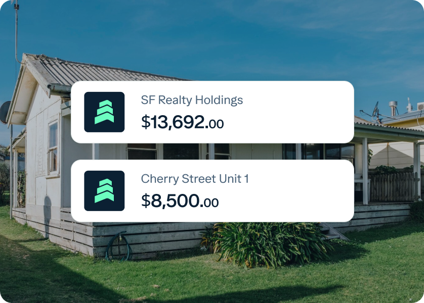 A small, white house with a garden in front. Two digital price tags are overlaid on the image. The first tag reads "SF Realty Holdings $13,692.00," and the second one reads "Cherry Street Unit 1 $8,500.00." The sky is clear and blue.