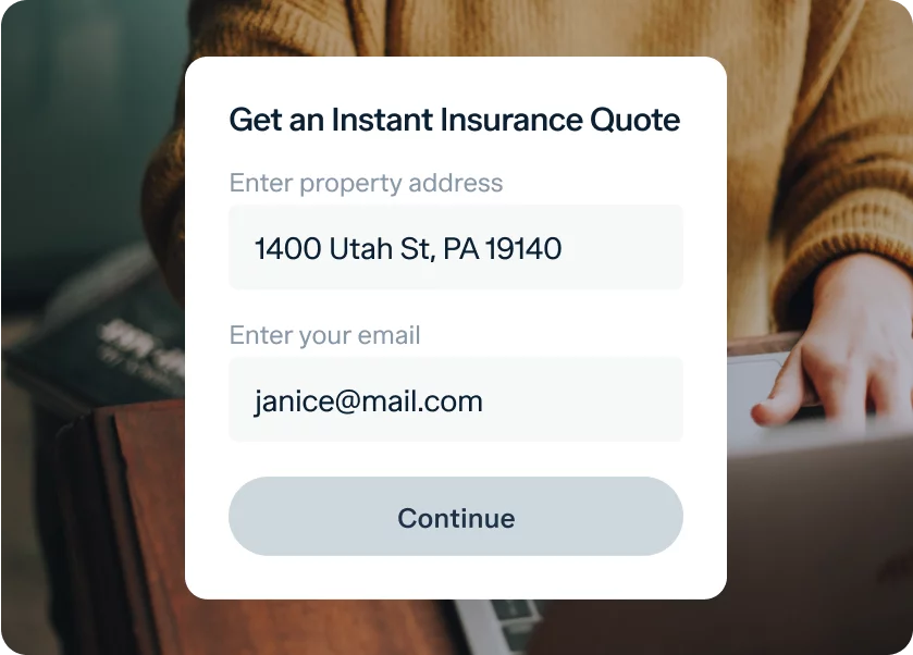 A person in a brown sweater is using a laptop. Overlaid on the image is a form that reads, "Get an Instant Insurance Quote." The form fields are filled with "1400 Utah St, PA 19140" for the property address and "janice@mail.com" for the email, with a "Continue" button below.
