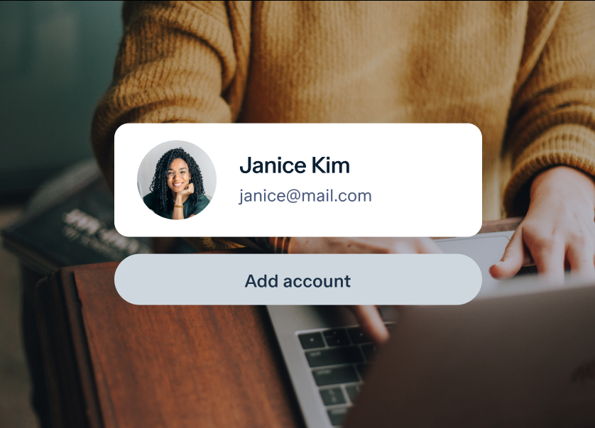 A person wearing a mustard-colored sweater is typing on a laptop. A profile card overlay shows a photo of a woman with curly hair, the name "Janice Kim," and an email "janice@mail.com." Below the profile card, there's a button labeled "Add account.