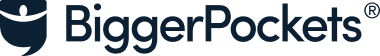 Logo of BiggerPockets, featuring a blue shield-like symbol with a semicircle on top to the left, followed by the text "BiggerPockets" in blue.