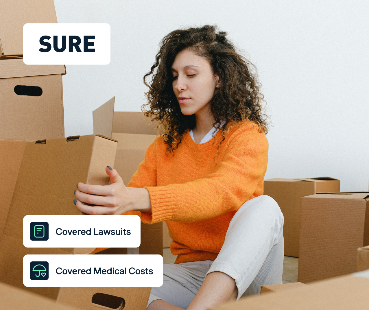A woman with curly hair, wearing an orange sweater and white pants, is seated among several cardboard boxes. There is a text "SURE" at the top left corner, and two icons with text below: "Covered Lawsuits" and "Covered Medical Costs".