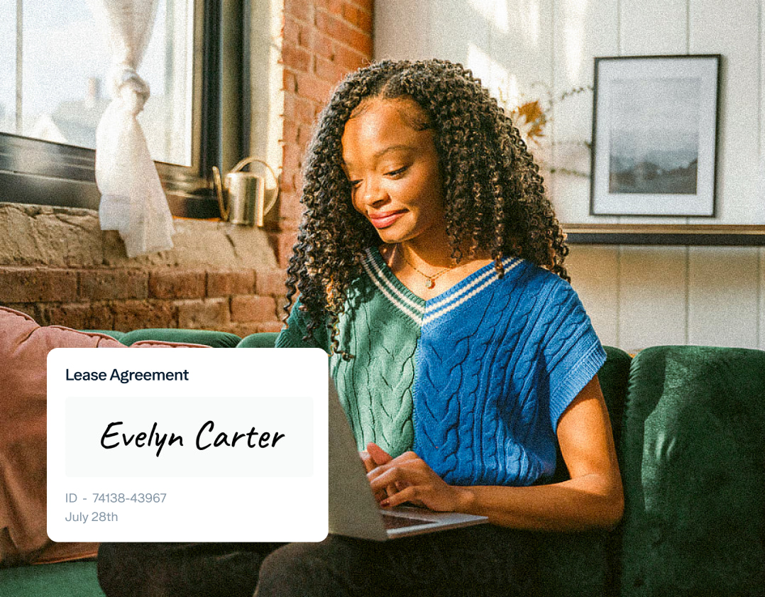 A woman with curly hair sits on a green couch, smiling as she looks at her laptop. A lease agreement with the name "Evelyn Carter" and details "ID - 74138-43967, July 28th" is displayed in the foreground. The room is cozy with a brick wall and a framed picture.