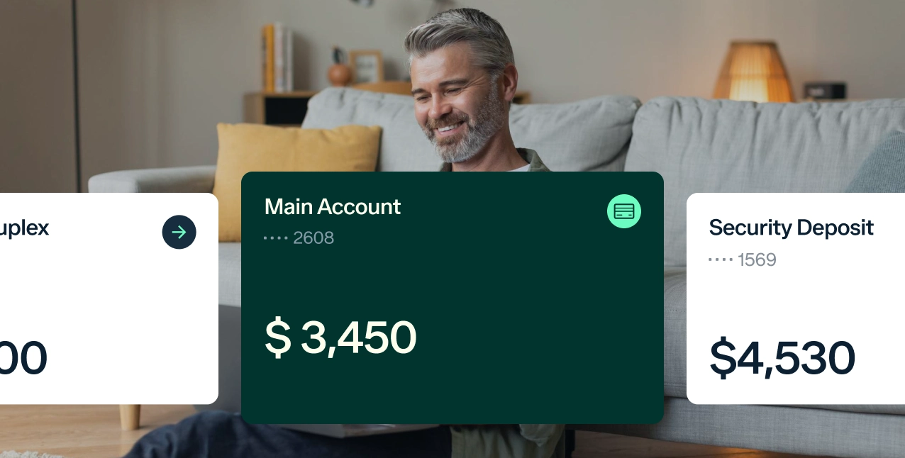 A person sits on a couch holding a tablet. Two digital bank account balances are displayed: Main Account with $3,450, and Security Deposit with $4,530. The background shows a cozy living room setting.