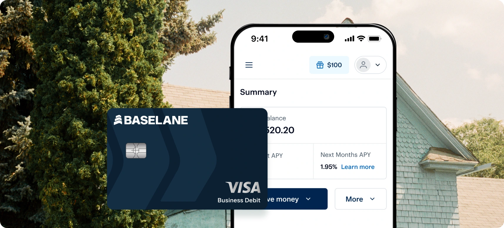 A smartphone displaying a financial app summary with a balance of $20.20. In front of the phone is a dark blue Visa business debit card. Background shows the gable end of a house and tree under a clear sky.