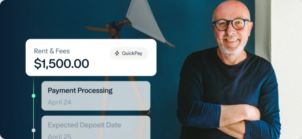 A smiling man with glasses and a beard stands with arms crossed in front of a blue wall. On the left, a digital display highlights "Rent & Fees $1,500.00" with QuickPay—an easy way to track payments from your business vs personal bank account​.